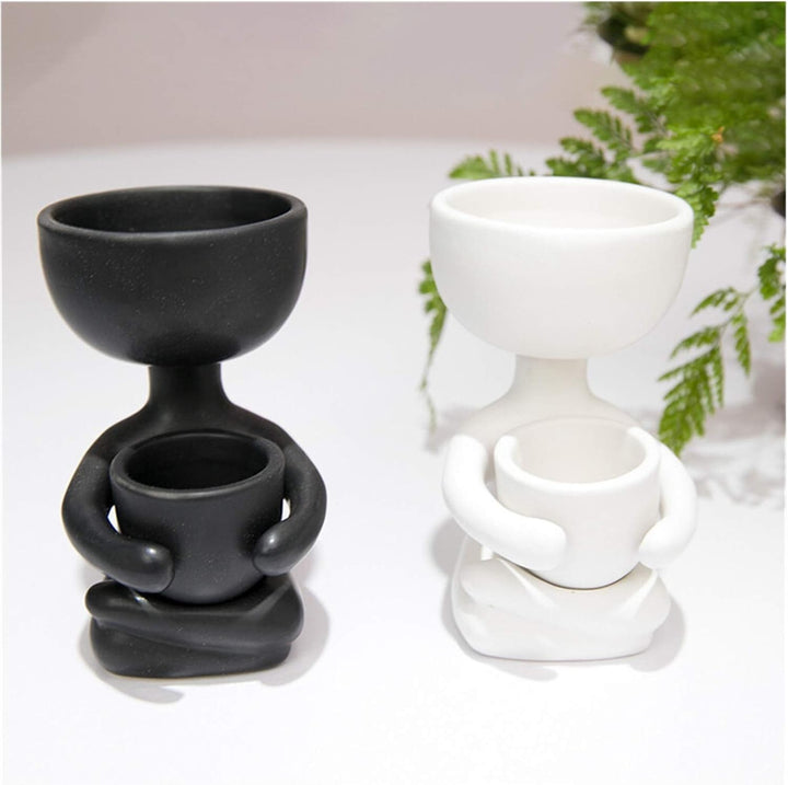 VibeCore Lil Buddy Planter in black and white (Option C and D), quirky humanoid design, Nordic-inspired style, crafted from premium clay, ideal for adding personality and charm to your plant display.