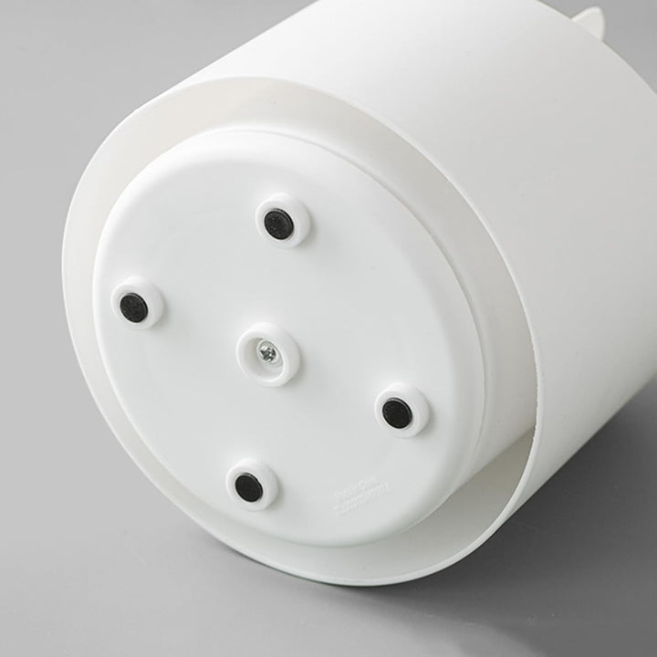 VibeCore Little Ears Rotating Makeup Brush Holder White, showing the bottom of the holder with its smooth rotating base for easy access to makeup brushes and beauty tools.