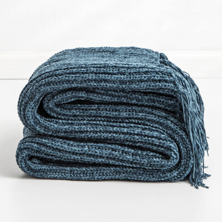 Blue Long Tassel Knitted Throw Blanket, offering a chic tassel design and ultra-soft comfort. Crafted from premium polyester, this cozy blanket adds texture and flair to any space. Perfect for dorm rooms, living rooms, or any cozy corner.