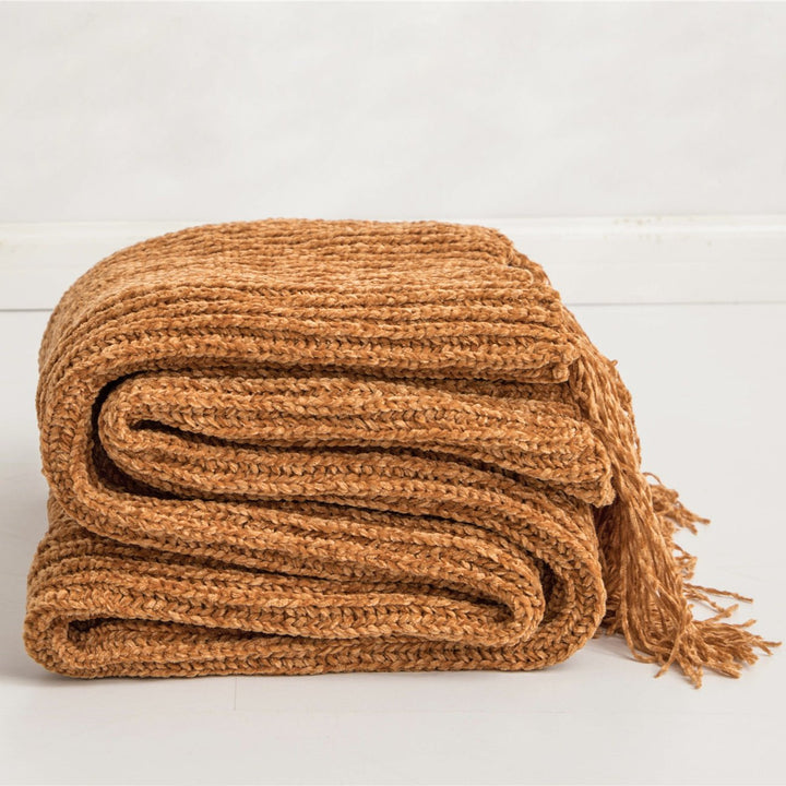 Orange Long Tassel Knitted Throw Blanket, offering a chic tassel design and ultra-soft comfort. Crafted from premium polyester, this cozy blanket adds texture and flair to any space. Perfect for dorm rooms, living rooms, or any cozy corner.