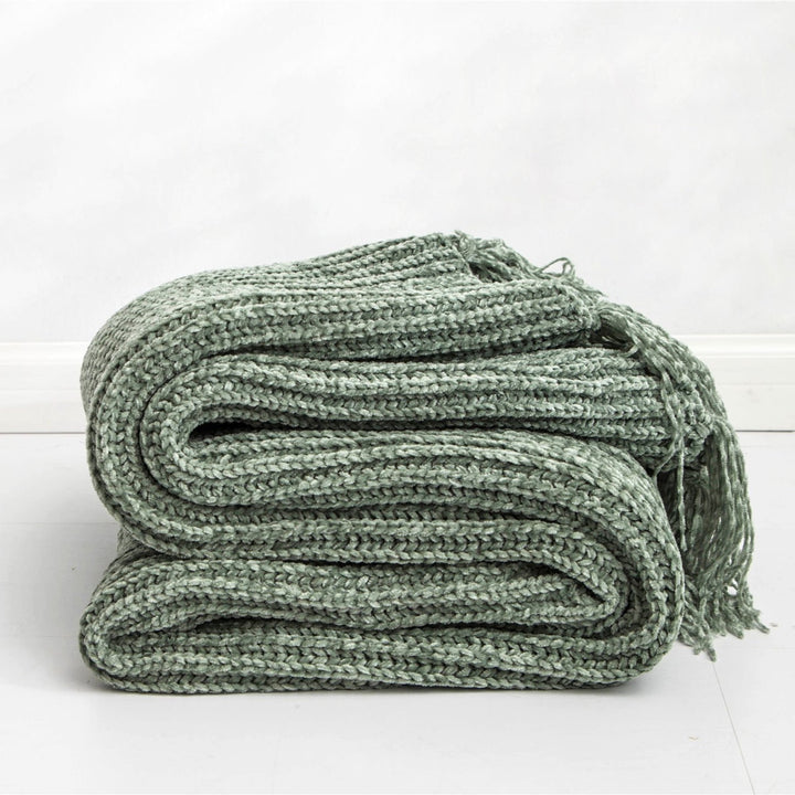 Sage Long Tassel Knitted Throw Blanket, offering a chic tassel design and ultra-soft comfort. Crafted from premium polyester, this cozy blanket adds texture and flair to any space. Perfect for dorm rooms, living rooms, or any cozy corner.