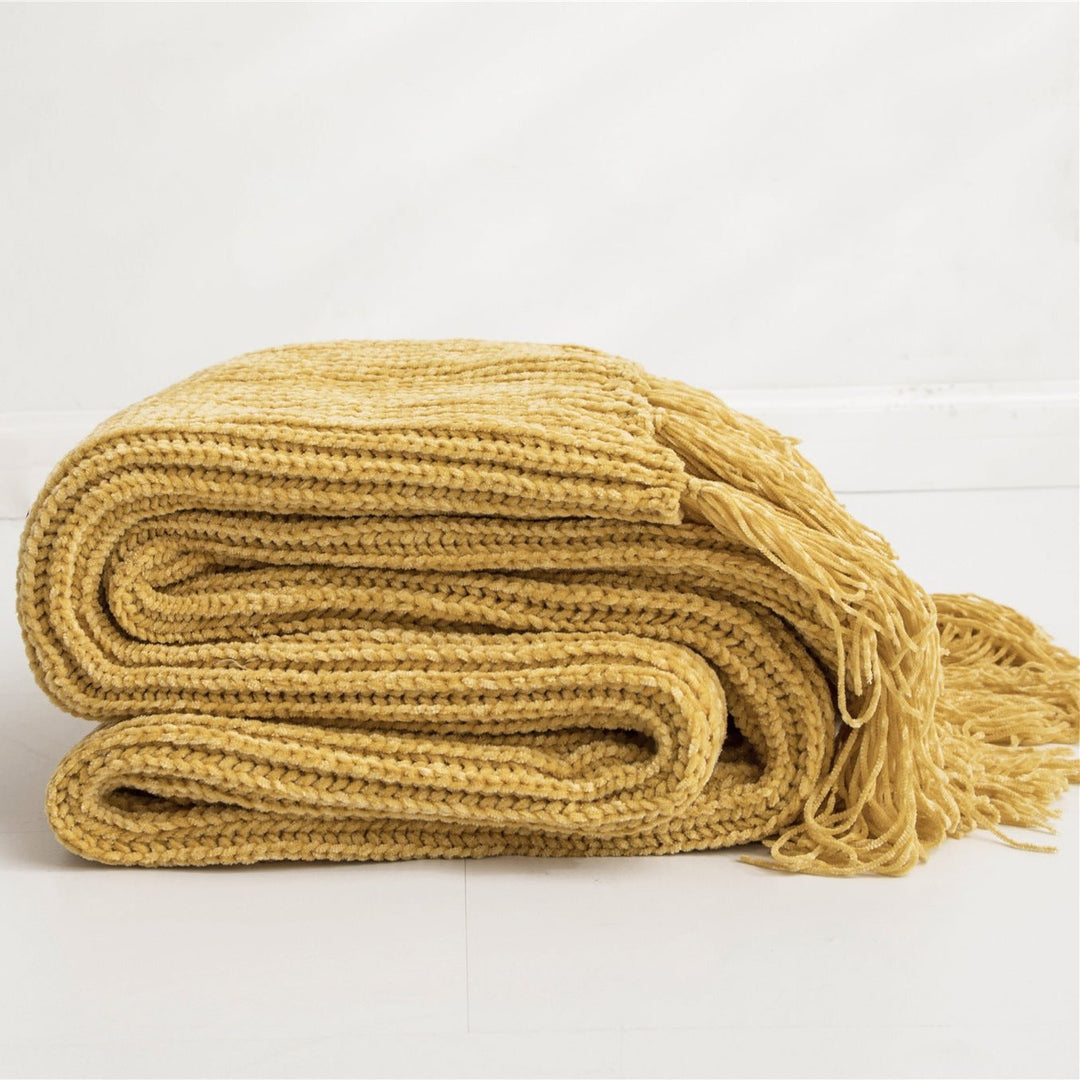 Yellow Long Tassel Knitted Throw Blanket, offering a chic tassel design and ultra-soft comfort. Crafted from premium polyester, this cozy blanket adds texture and flair to any space. Perfect for dorm rooms, living rooms, or any cozy corner.