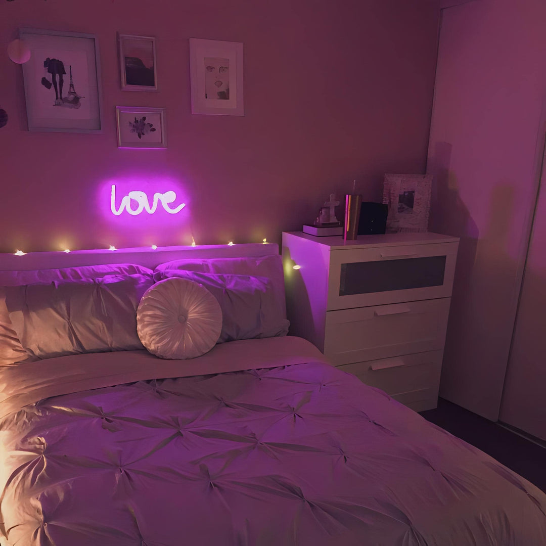 Aesthetic VibeCore Love Neon Light in pink on the wall above the bed, USB or battery-powered LED sign for trendy bedroom decor, creating a warm, romantic glow to elevate your space.