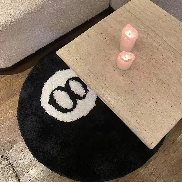 VibeCore Lucky 8 Ball Accent Rug under a side table in a living room to demonstrate its aesthetic appeal and size in a real space. Offers a cool and contemporary decor addition to the floor.
