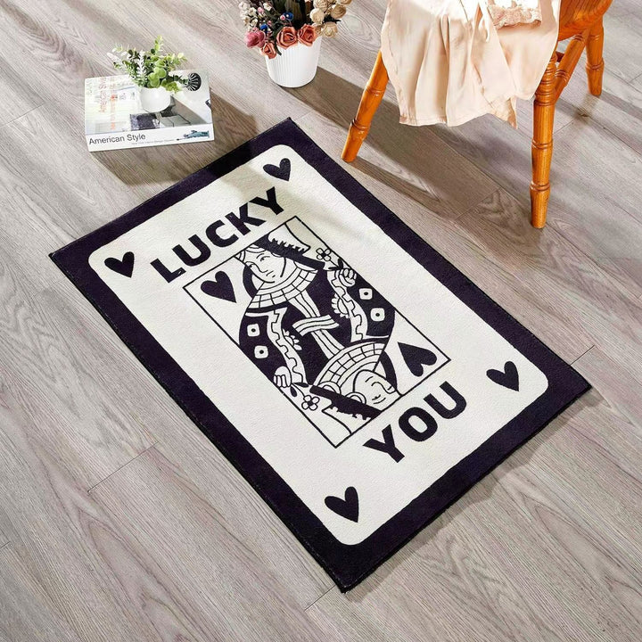 Aesthetic black and white "Lucky You" accent rug with a playful card design, photographed from an angled aerial view. This soft, fluffy rug features a non-slip bottom for safety, making it perfect for bedrooms, dorms, or living spaces. Stylish and easy to clean, it adds a unique touch to any aesthetic room decor.