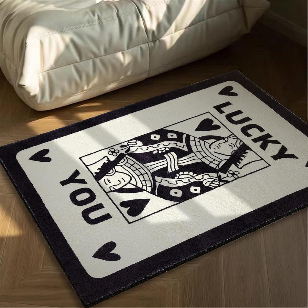 Aesthetic black and white "Lucky You" accent rug with a playful card design, shown from an angled view. This soft, fluffy rug features a non-slip bottom for safety, making it perfect for dorms, bedrooms, and cozy spaces. Stylish and easy to clean, it enhances any aesthetic room decor.
