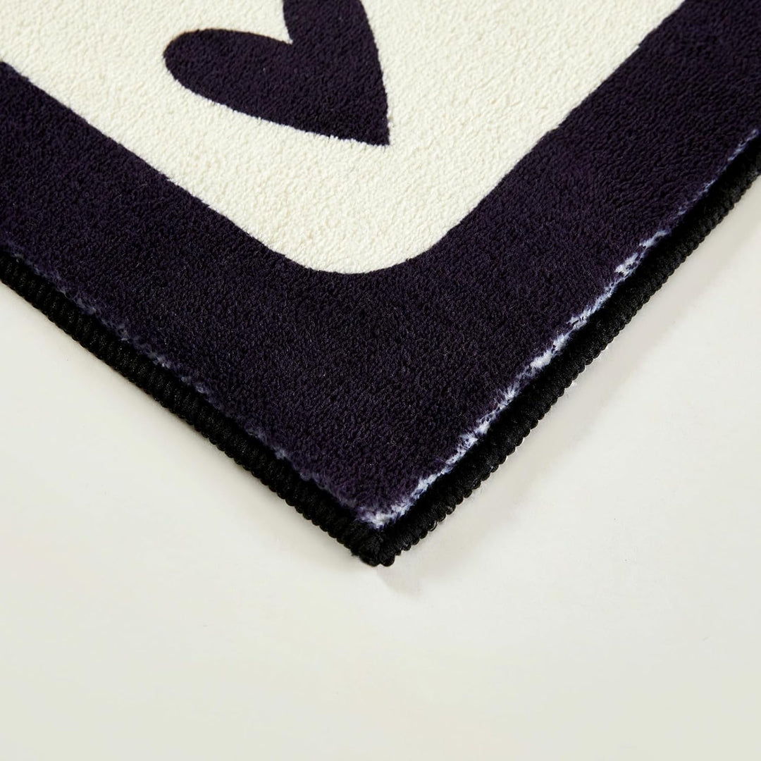 Aesthetic black and white "Lucky You" accent rug with a playful card design, shown in a corner close-up. This detailed view highlights the plush texture, precise stitching, and non-slip backing, making it a stylish and functional addition to any bedroom, dorm, or cozy space.