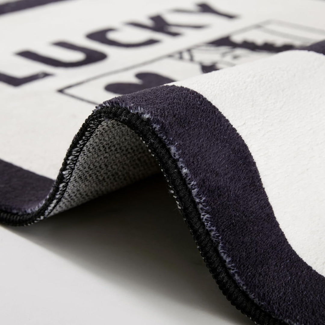 Aesthetic black and white "Lucky You" accent rug material close-up, showcasing its soft, fluffy texture and high-quality fabric. This detailed view highlights the plush feel and durable construction, perfect for adding comfort and style to any bedroom, dorm, or cozy space.