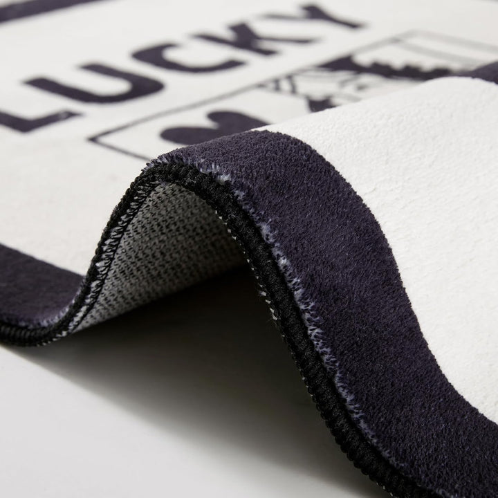 Aesthetic black and white "Lucky You" accent rug material close-up, showcasing its soft, fluffy texture and high-quality fabric. This detailed view highlights the plush feel and durable construction, perfect for adding comfort and style to any bedroom, dorm, or cozy space.