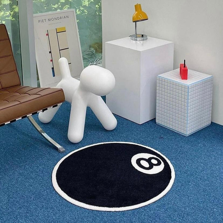VibeCore Magic 8 Ball Accent Rug aerial view, featuring a bold black and white 8 ball design. This round rug adds a retro touch to any space, offering a cool, playful vibe and unique floor accent for your bedroom, dorm, or living room.