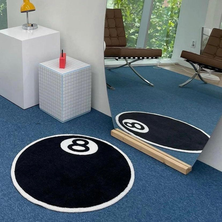 VibeCore Magic 8 Ball Accent Rug in a living room, featuring a bold black and white design with a playful 8 ball graphic. Perfect as a cute round rug, contemporary accent rug, or unique addition to your decor, this rug brings a fun, retro vibe and a touch of nostalgia to any space.