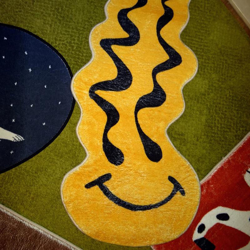 VibeCore Melted Smiley Accent Rug on carpet, showcasing a bold, dripping smiley face design that adds a playful, quirky vibe to the space.