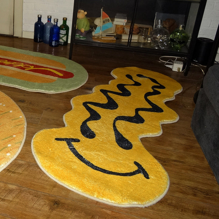 VibeCore Melted Smiley Accent Rug on wooden floor, featuring a bold, dripping smiley face design, adding a quirky and playful touch to the room's aesthetic.