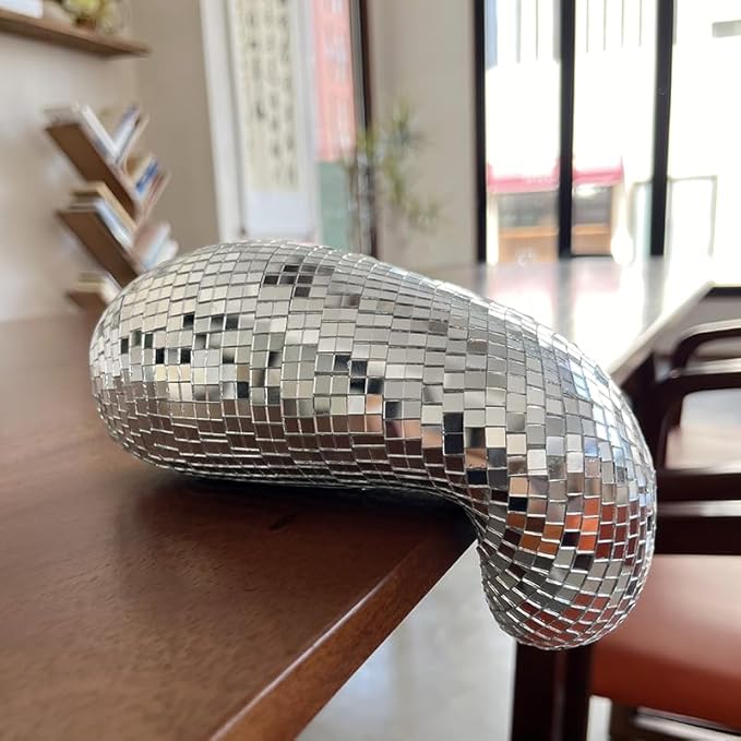 Close-up of VibeCore Melting Disco Ball showing intricate reflective surface and melting design details.