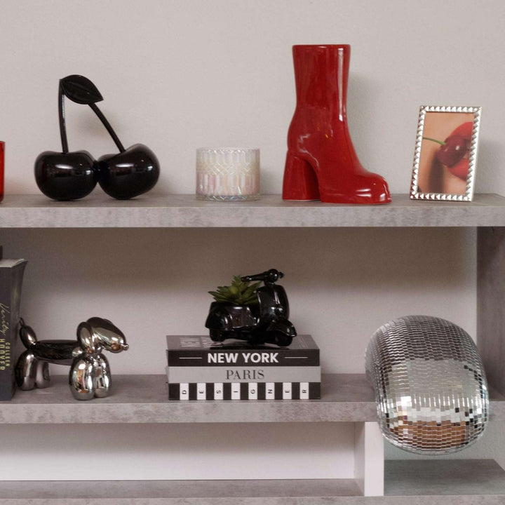 VibeCore Melting Disco Ball placed on a wall shelf, adding a playful and dynamic touch to the room with its reflective surface.