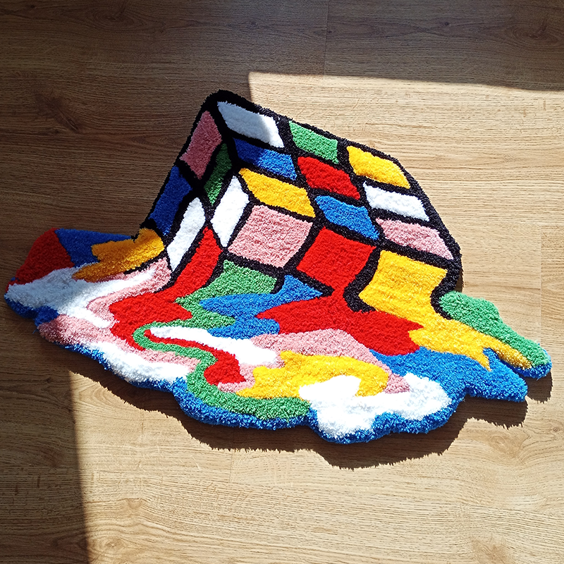 Aerial view of the VibeCore Melting Rubik's Cube Accent Rug, showcasing its vibrant, trippy design with colorful puzzle-inspired patterns. Perfect for modern room decor.