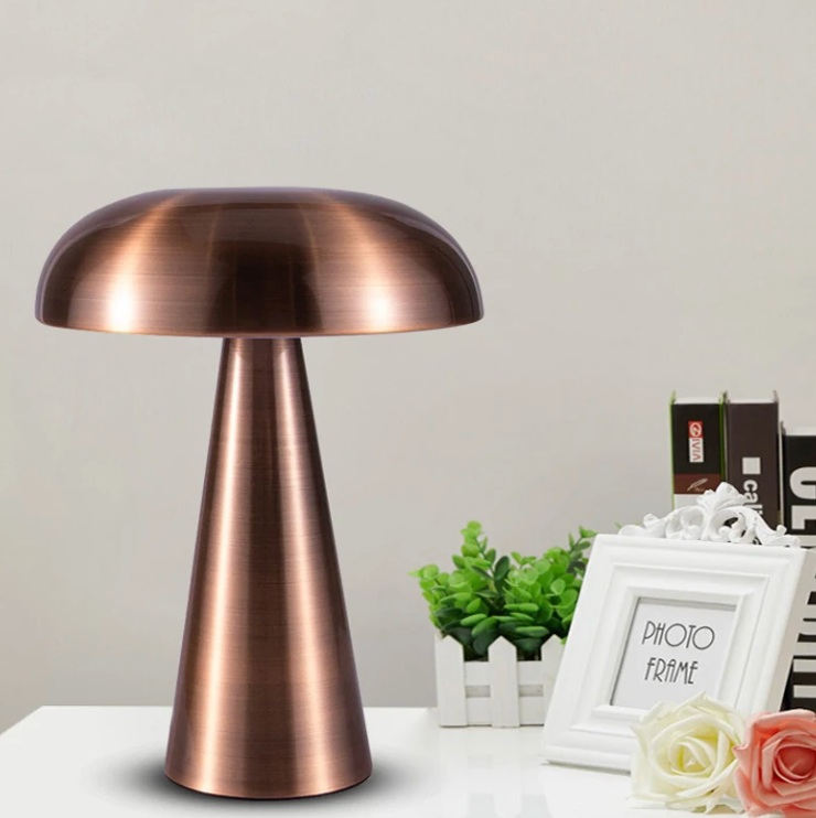 VibeCore Metal Mushroom Touch Lamp in bronze, placed on a dresser, showcasing its minimalist Bauhaus-inspired design and touch-controlled brightness.