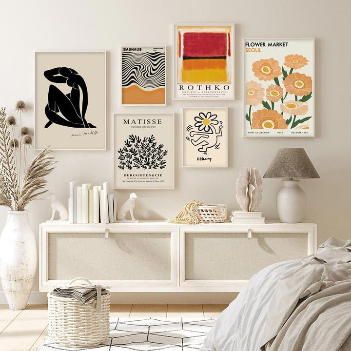 
"Modern Art Classics Canvas Posters" wall collage showcasing iconic designs from Matisse, Keith Haring, and Rothko. Featuring bold shapes and vibrant colors, this collection creates a dynamic, contemporary vibe in any room. Perfect for curating a chic, minimalist gallery wall with lasting, fade-resistant prints on premium cotton canvas.