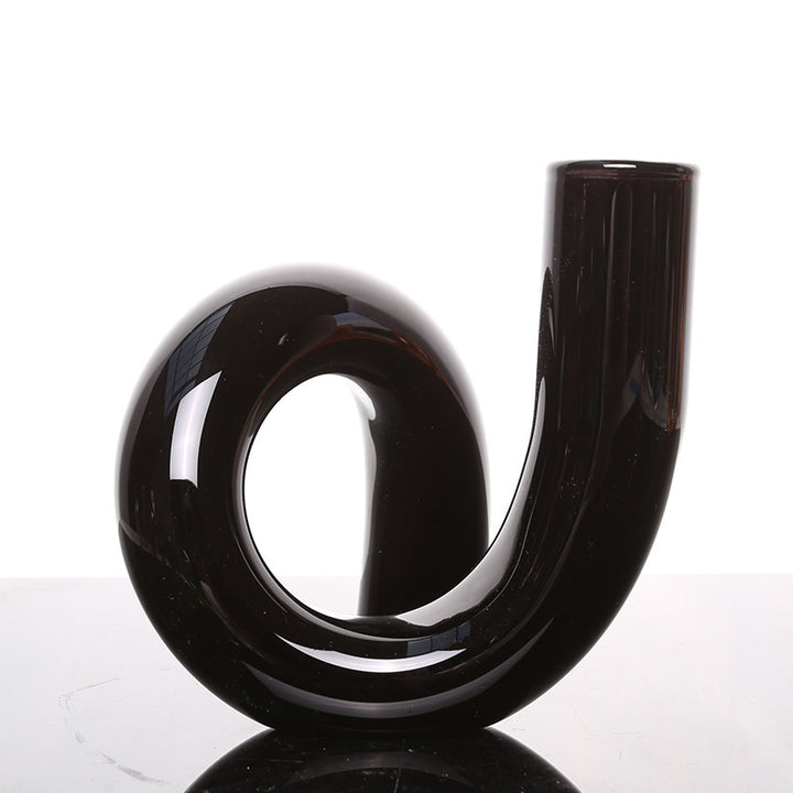 VibeCore Modern Twist Glass Candle Holder in black borosilicate glass with a polished finish, stylish dual-use design for candles or flowers in minimalist spaces.