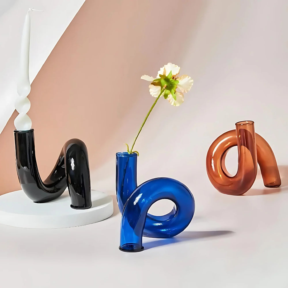 VibeCore Modern Twist Glass Candle Holders in black, blue, and brown borosilicate glass, featuring minimalist twisted design for modern home or shelf decor.