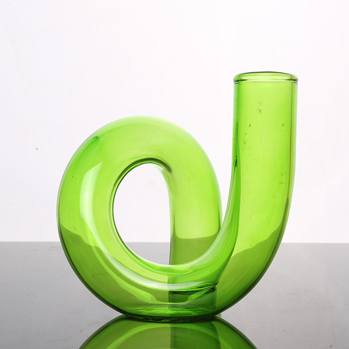 VibeCore Modern Twist Glass Candle Holder in green borosilicate glass with a polished finish, dual-use vase and candle holder for modern minimalist decor.