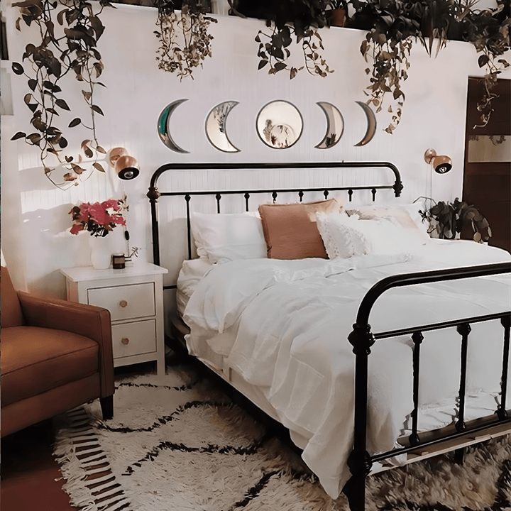 VibeCore Moon Phases Mirror Set in black, displayed in a boho room. Featuring a sleek black design, this set showcases the phases of the moon, adding a mystical and bohemian touch to the decor. Perfect for creating a unique, cosmic vibe, the mirrors blend effortlessly with boho aesthetics, enhancing the room’s ambiance.