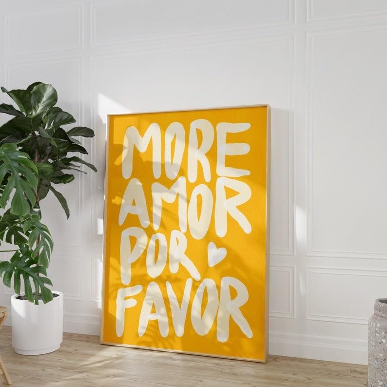 Angled view of vibrant yellow ‘More Amor Por Favor’ canvas poster leaning against a wall, featuring a bold, playful love message with a maximalist design, perfect for adding personality and warmth to any room.