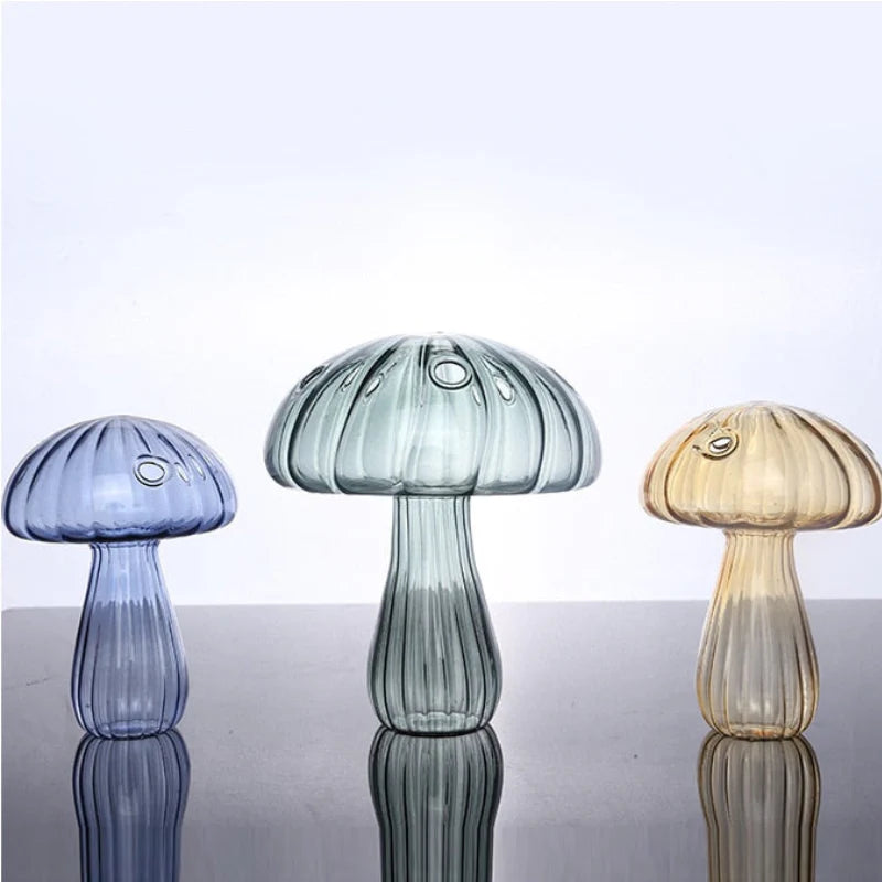 Mushroom Glass Vase in blue-gray, blue, and yellow arranged together showcasing their unique, colorful design and elegant glass craftsmanship.