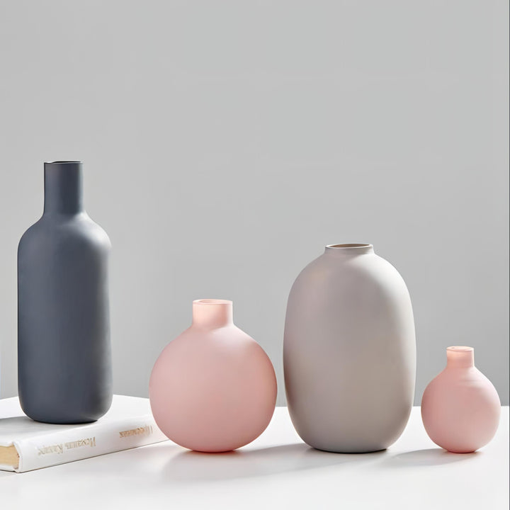 All four VibeCore Nordic Ceramic Vases in pink, mini pink, gray, and dark gray displayed together, showcasing modern minimalist ceramic home decor styles.