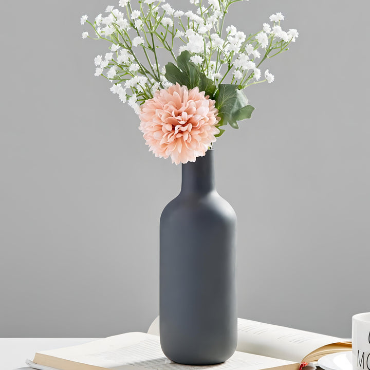 VibeCore Nordic Ceramic Vase in dark gray with flowers arranged inside, highlighting minimalist Nordic design and modern ceramic home decor style.