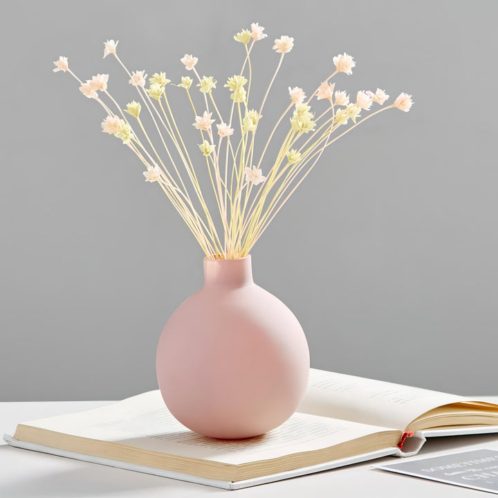 VibeCore Nordic Ceramic Vase Pink with flowers, showcasing a soft matte finish and minimalist Nordic design, ideal for modern home or office decor.