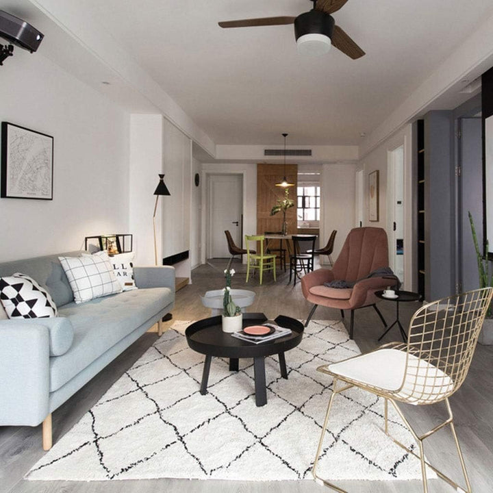 The VibeCore Nordic Shaggy Area Rug shown from an alternative angle in a cozy apartment setting, emphasizing its soft texture and minimalist design. The rug brings warmth and a serene vibe to the room's decor.