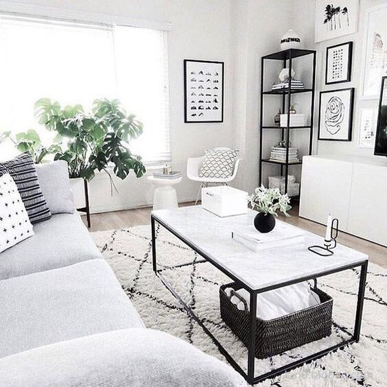 The VibeCore Nordic Shaggy Area Rug shown from an alternative angle in a living room, highlighting its plush texture and minimalist Scandinavian design. The rug complements the room's modern decor with its soft, neutral hues.