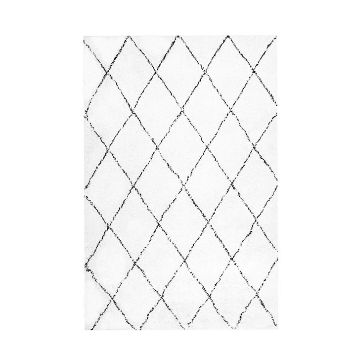 The VibeCore Nordic Shaggy Area Rug displayed in a clean, well-lit setting, showcasing its plush texture and minimalist design. The rug's soft, hand-woven polyester material adds a cozy touch to any room.