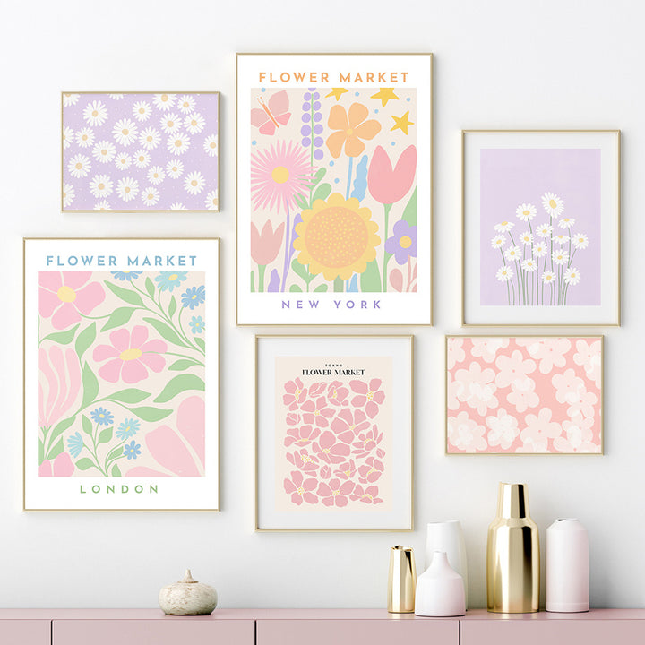 Another framed collage of ‘Pastel Flower Market’ canvas posters displayed on the wall, featuring soft pastel floral prints inspired by iconic flower markets in cities like Barcelona, Istanbul, London, New York, and Tokyo.