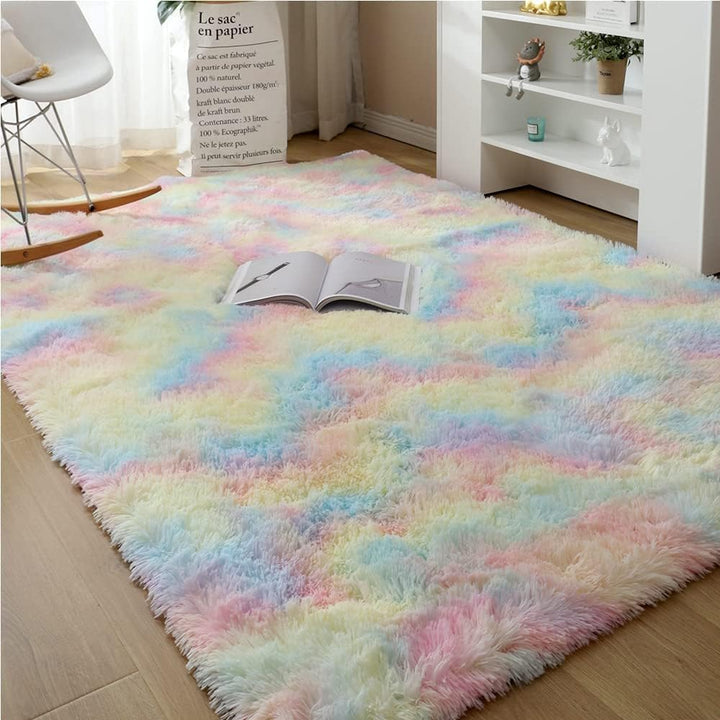 VibeCore Pastel Rainbow Tie-Dye Area Rug material angled aerial view, highlighting the plush texture and vibrant pastel colors blending seamlessly for a cozy, stylish look.