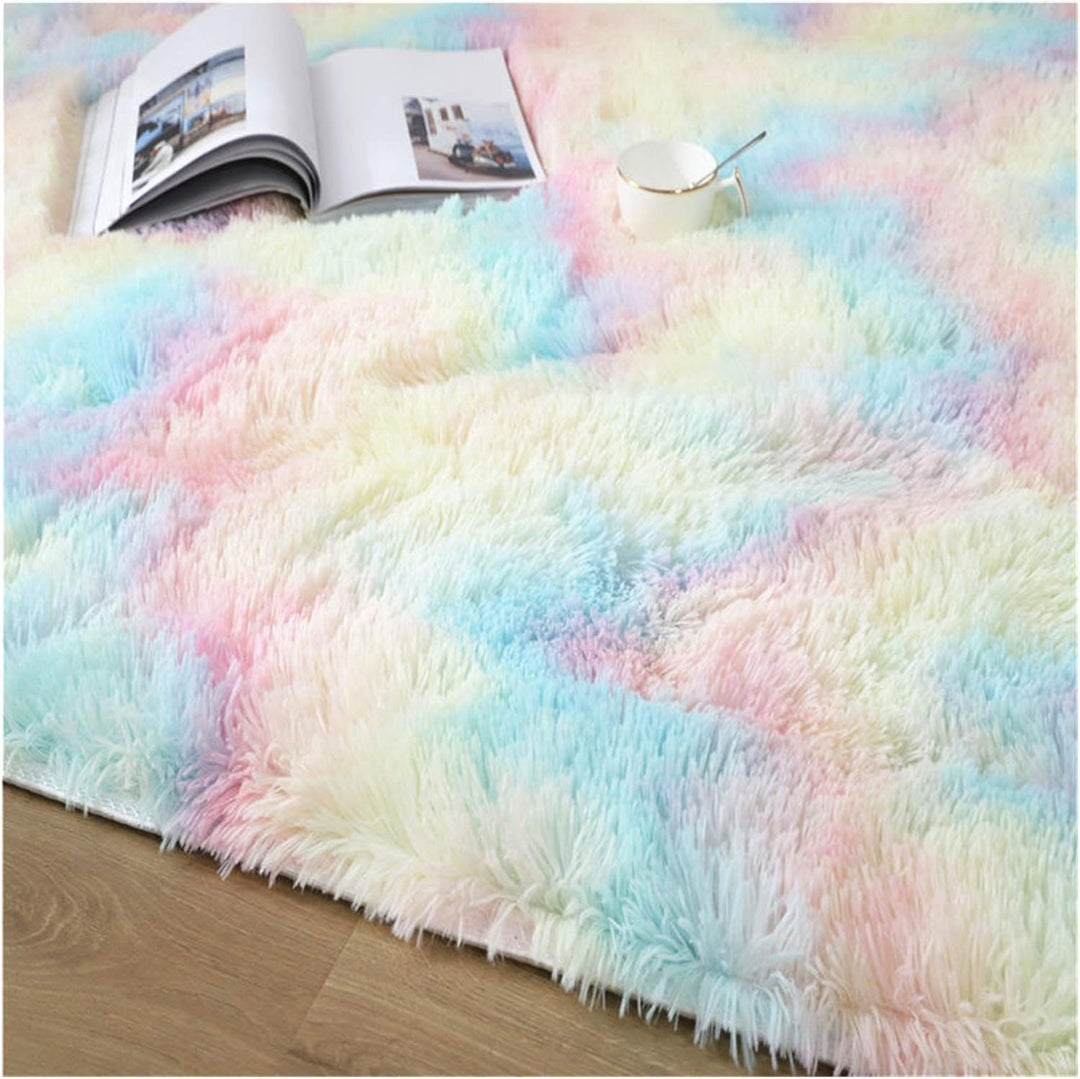 VibeCore Pastel Rainbow Tie-Dye Area Rug material close-up, showcasing the soft polyester fiber texture and vibrant pastel hues blending together for a cozy, colorful look.