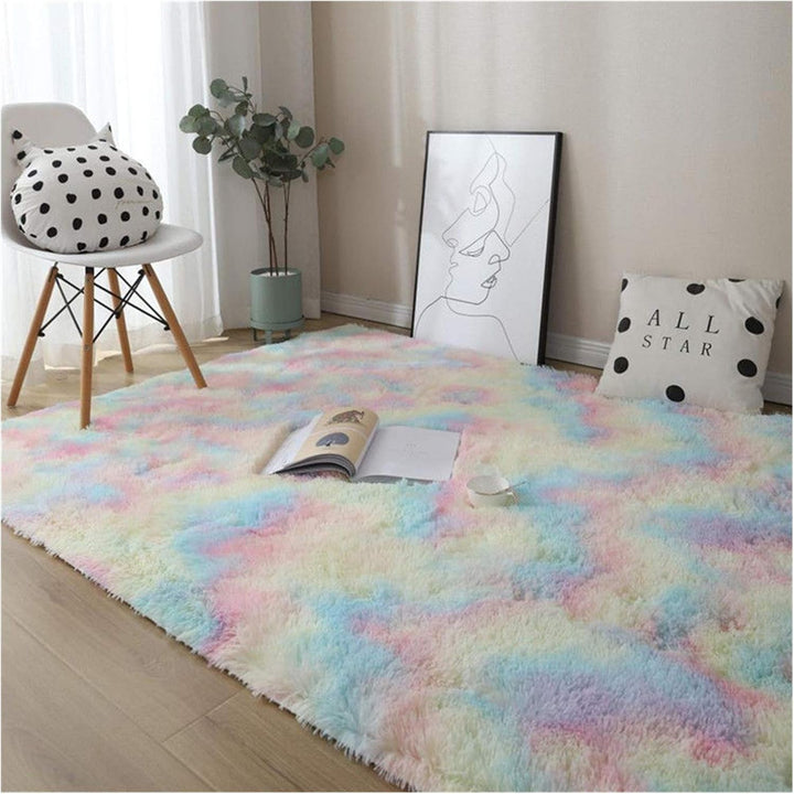 VibeCore Pastel Rainbow Tie-Dye Area Rug on the floor, showcasing vibrant pastel colors and soft texture, adding a cozy and playful vibe to any room
