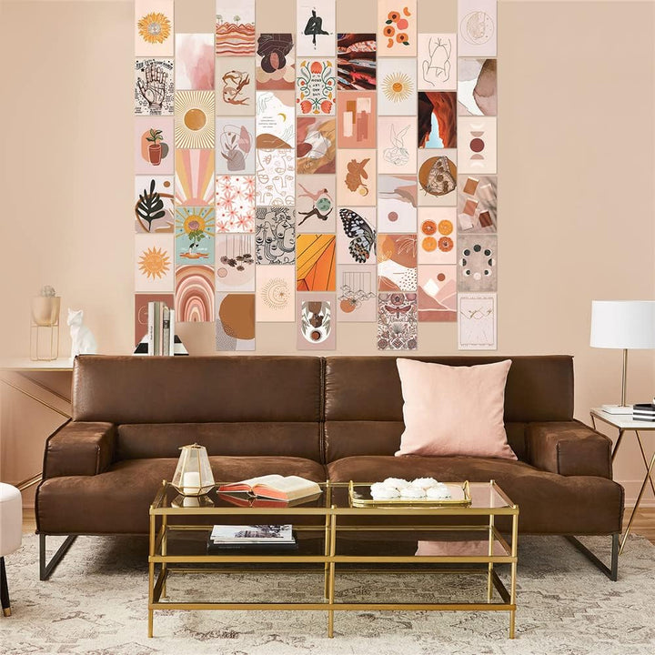 VibeCore Peace Goddess Wall Collage Kit displayed above a couch, featuring 70 calming prints in warm peach and orange tones with goddess-inspired and nature-themed designs. Brings a serene, feminine, and artistic touch to the living space.