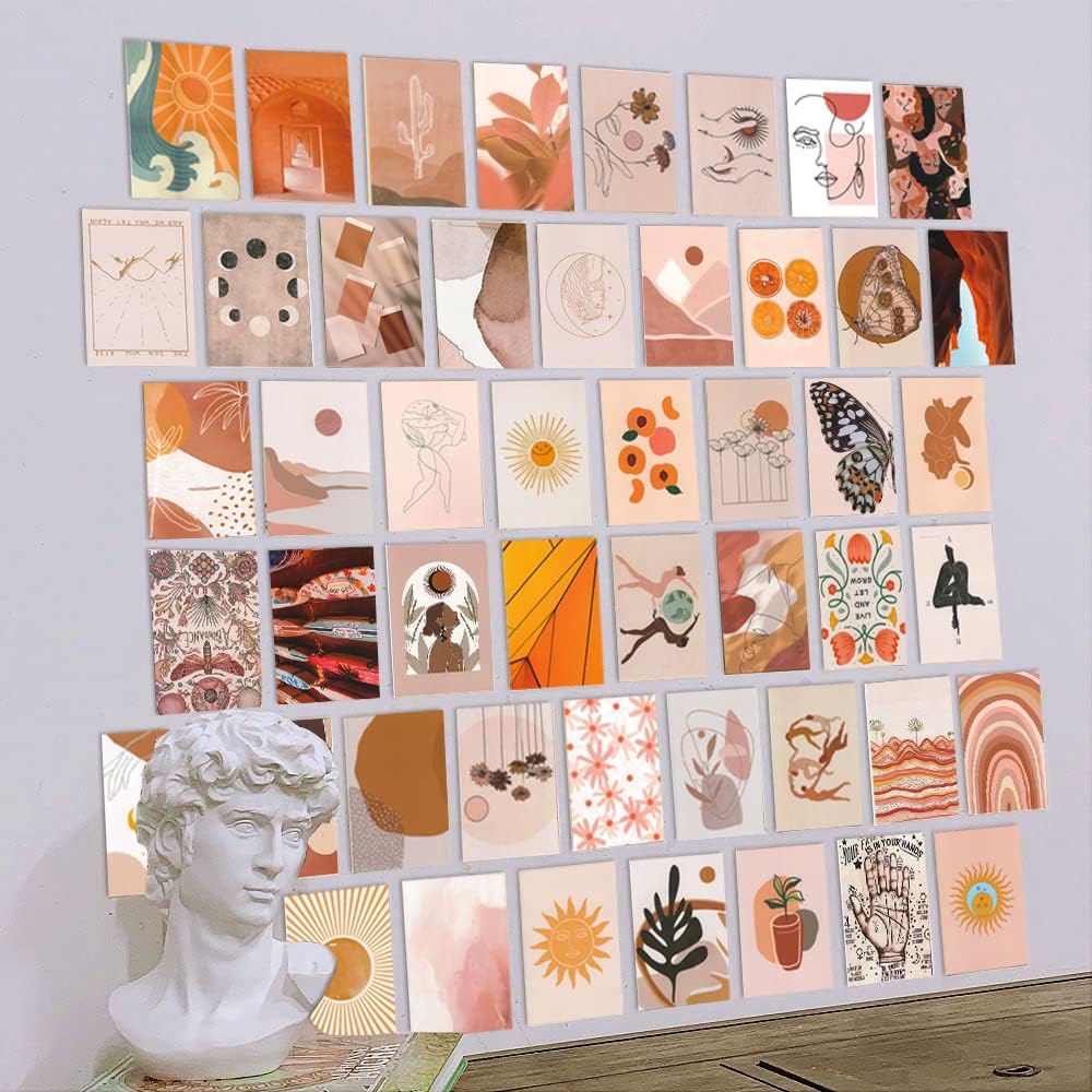 VibeCore Peace Goddess Wall Collage Kit displayed on a wall, featuring 70 calming prints in warm peach and orange tones with goddess-inspired and nature-themed designs. Creates a serene, feminine, and artistic atmosphere in any room.