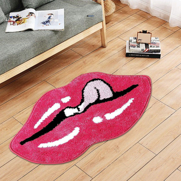 The VibeCore Pink Lips Tongue Out Accent Rug in a living room setting, featuring a bold, playful design with a pink lip and tongue motif. This soft, fluffy rug adds comfort and a touch of fun to any space, while its non-slip backing ensures stability, making it ideal for high-traffic areas like the living room.