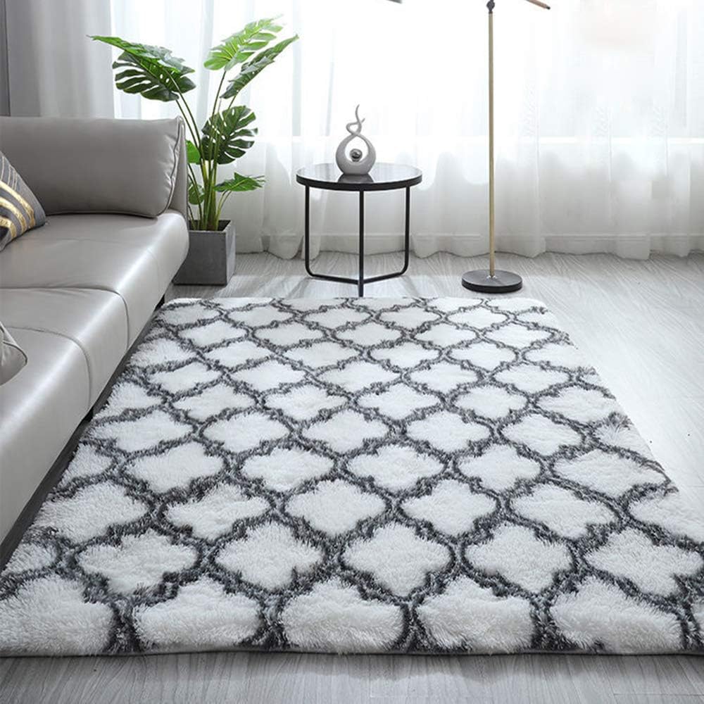 VibeCore Plush Patterned Area Rug in black design on a white background, featuring a soft polyester fiber texture and non-slip backing. Adds comfort and style to any room, perfect for living rooms, bedrooms, or dorms. Easy to clean and available in 5 stylish options.