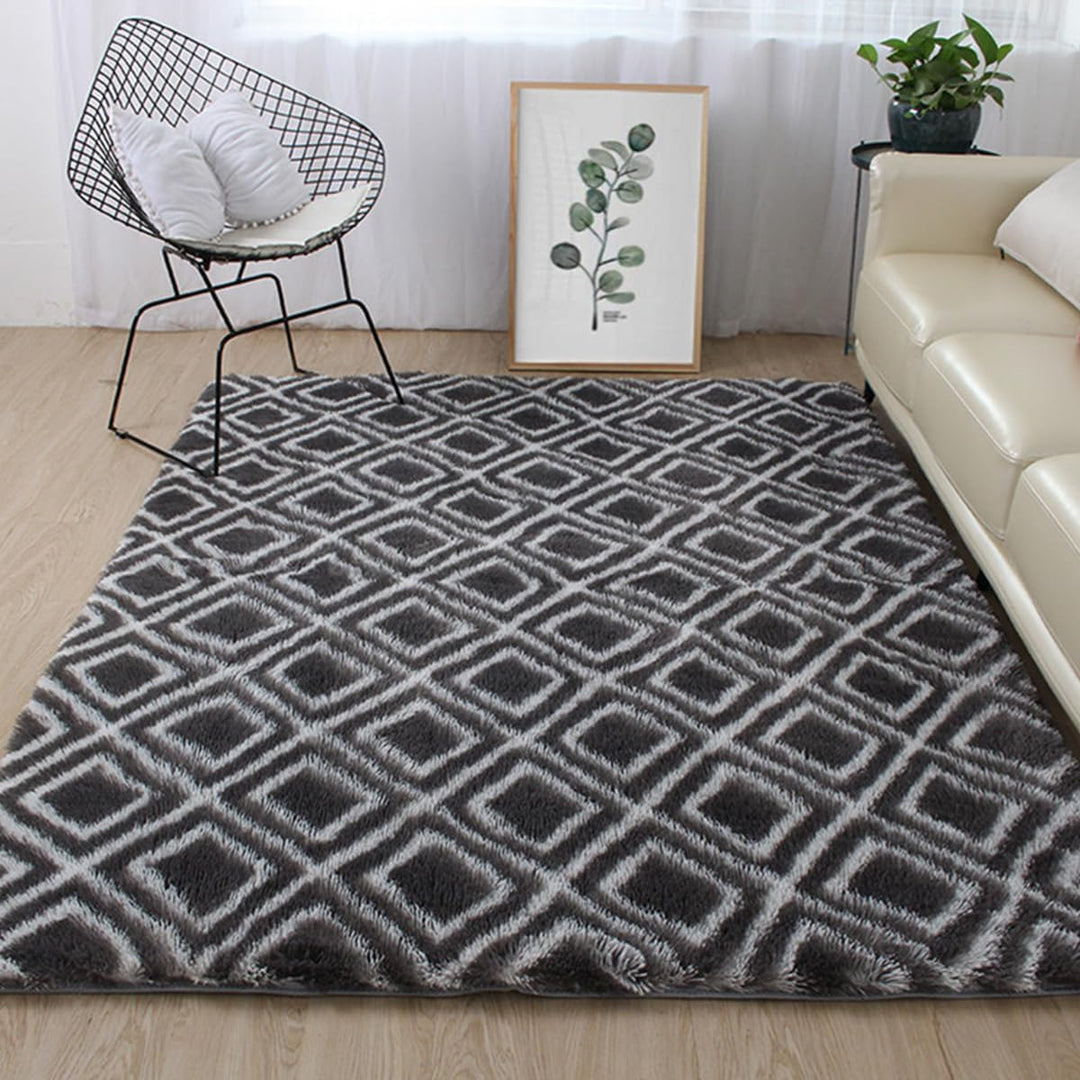 VibeCore Plush Patterned Area Rug in white design on a black background, placed in a living room, featuring a soft polyester fiber texture and non-slip backing. Adds a stylish and cozy touch to your space. Easy to clean and available in 5 stylish options.