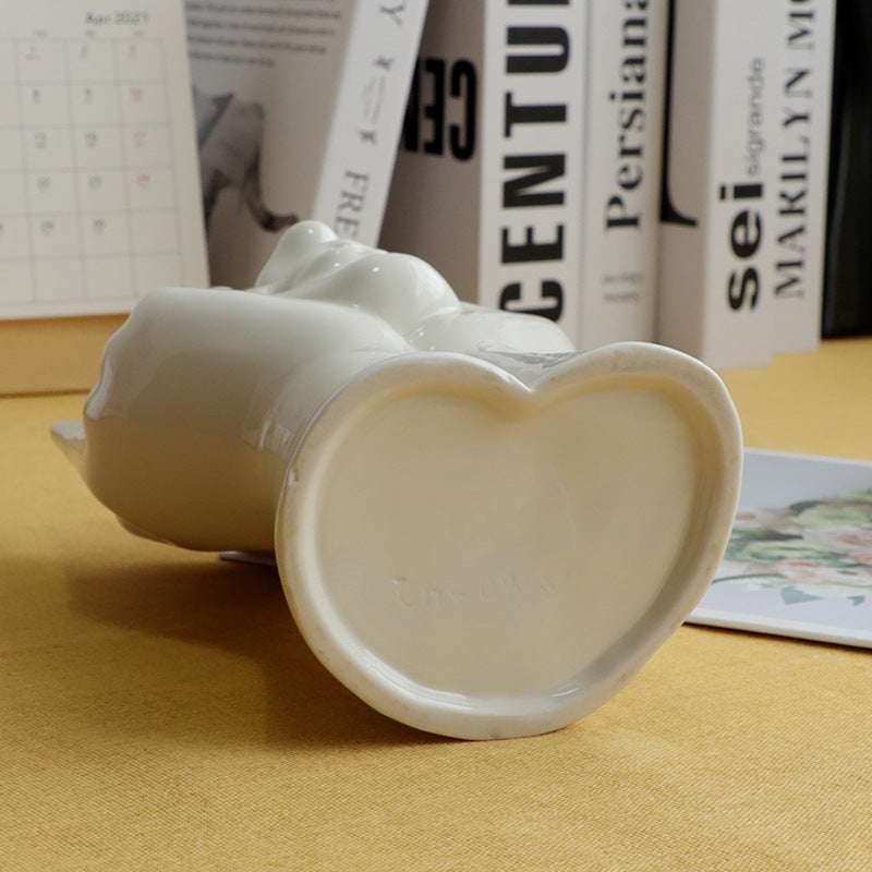 VibeCore Pondering Girl Ceramic Vase base view—displays the stable, flat underside with a smooth ceramic finish, ensuring secure placement on any surface.