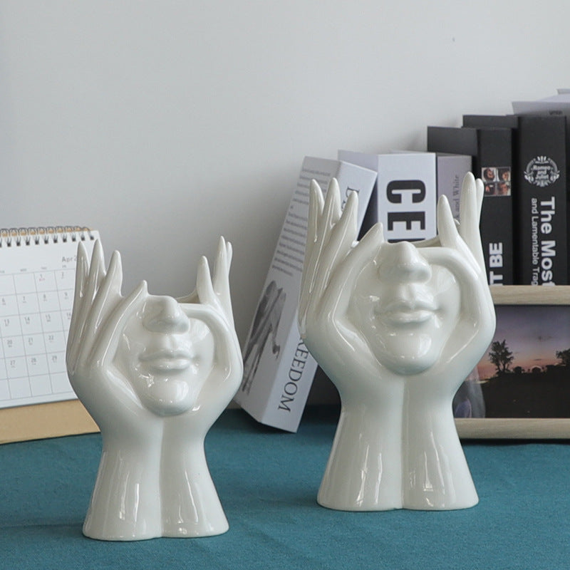 VibeCore Pondering Girl Ceramic Vase shown in both Small and Large sizes—an elegant, minimalist statement piece with a serene face design, perfect for modern decor.