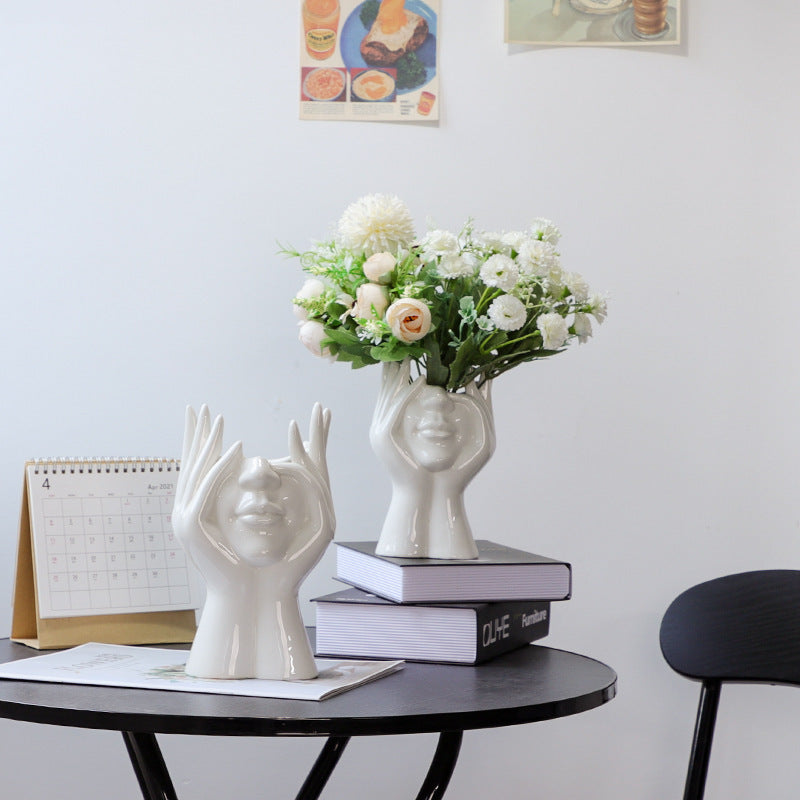 VibeCore Pondering Girl Ceramic Vase in Small and Large displayed on a table—adds sculptural elegance and modern charm to any surface or shelf.