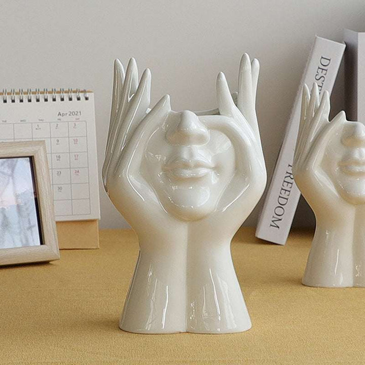 VibeCore Pondering Girl Ceramic Vase on a table—minimalist and expressive, this art-inspired piece stands out as a thoughtful decor accent in any room.