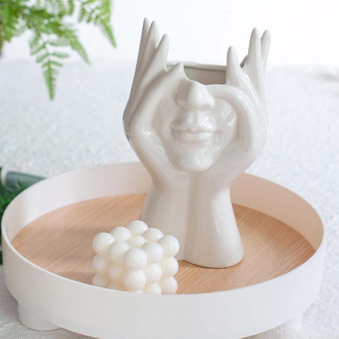 VibeCore Pondering Girl Ceramic Vase placed on a tray—perfect for adding a modern, curated touch to your coffee table or dresser with a serene, sculptural vibe.