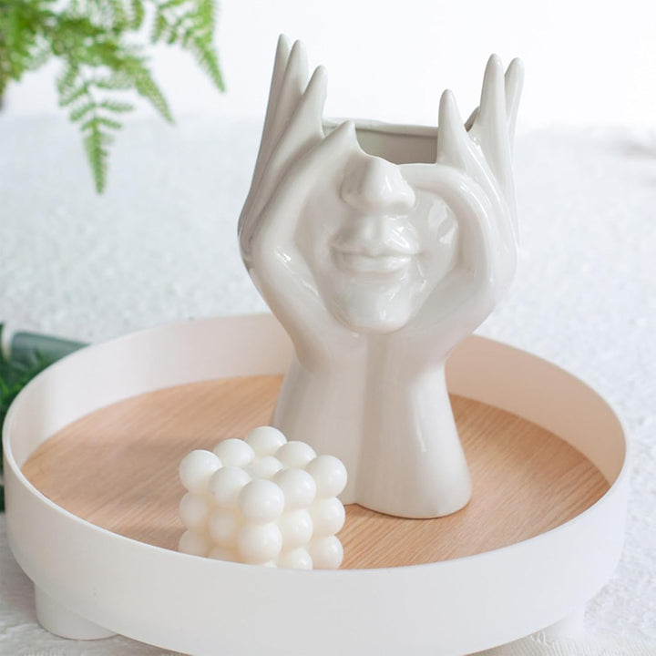 VibeCore Pondering Girl Ceramic Vase placed on a tray—perfect for adding a modern, curated touch to your coffee table or dresser with a serene, sculptural vibe.