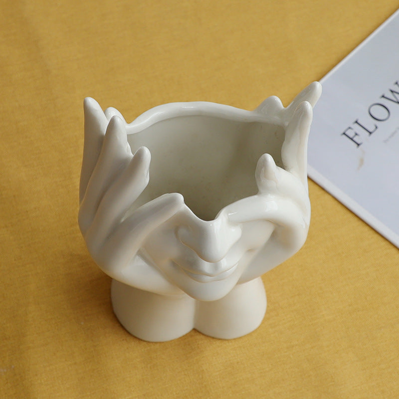 VibeCore Pondering Girl Ceramic Vase aerial view—showcases the smooth ceramic finish and thoughtfully sculpted opening, perfect for dried or faux florals.